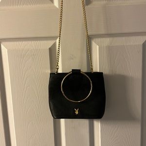 BNWOT PLAYBOY BLACK AND GOLD PURSE WITH ZIPPER.